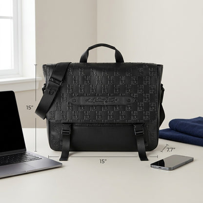 Bugatti Rolling Stones black leather messenger bag shown with dimensions beside a laptop and phone.